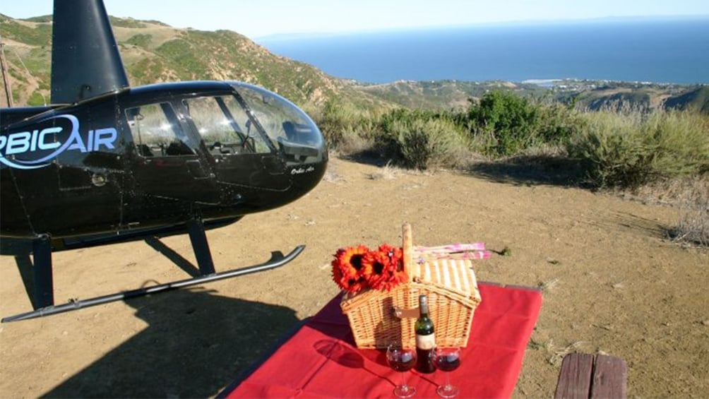 picnic basket set up near the grounded helicopter in Los Angeles