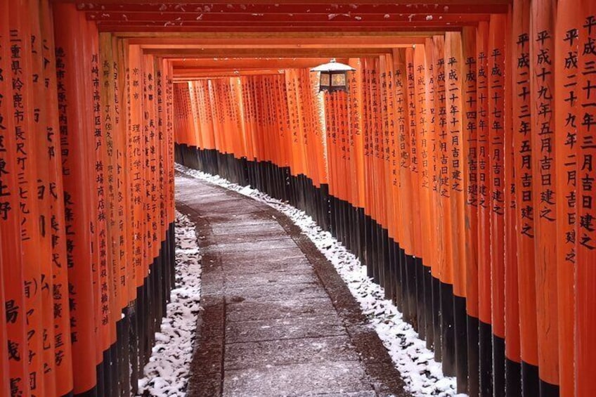 The red gates pathway of Fushimi Inari Shrine in Winter
