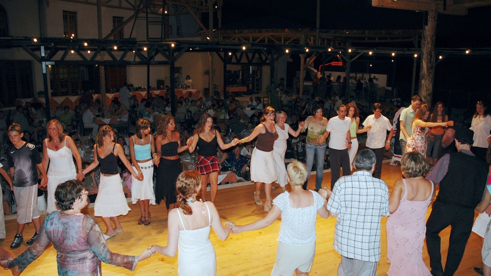 People doing a traditional greek dance in Crete