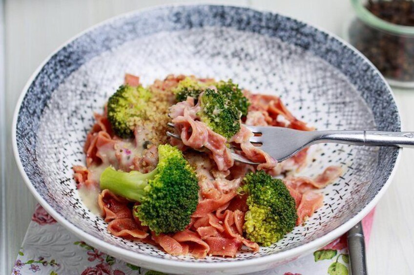 homemade pasta with beetroot, broccoli sauce