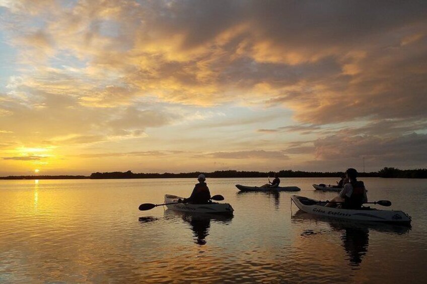 Relaxing paddle during sunset kayak tour