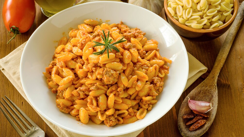 Shell pasta in a bowl laid on a table in Italy 