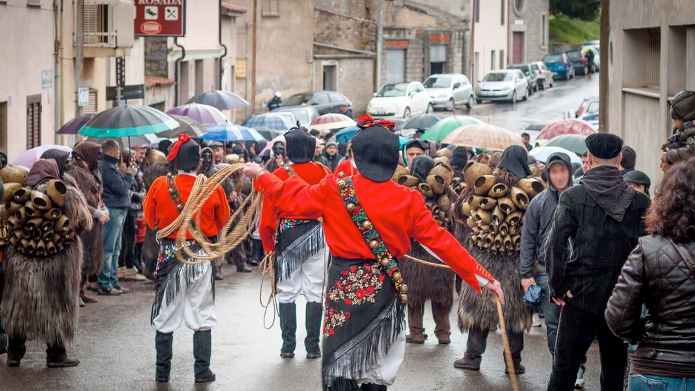 People walking the streets of Italy with some in uniform