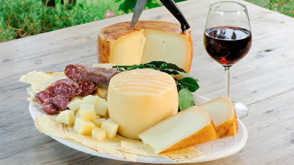 Wine, cheese and meat on a table in Cagliari