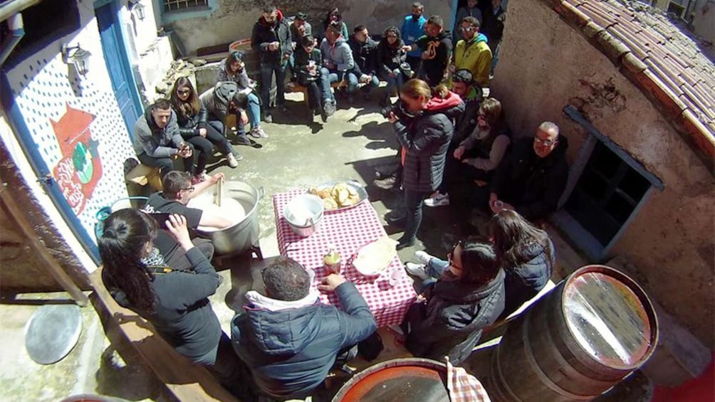 Tour group watching a demonstration in Barbagia