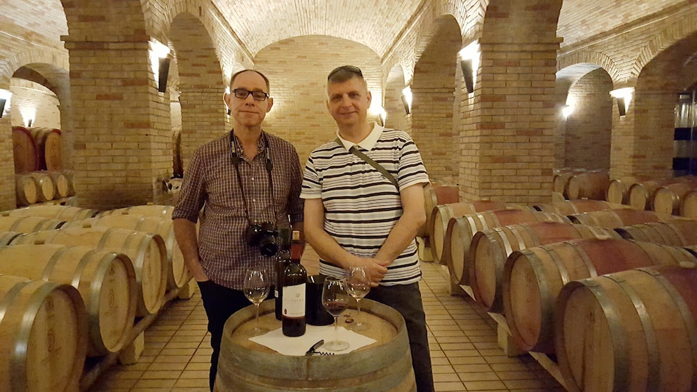 Show item 4 of 9. Men on wine tour in Cagliari