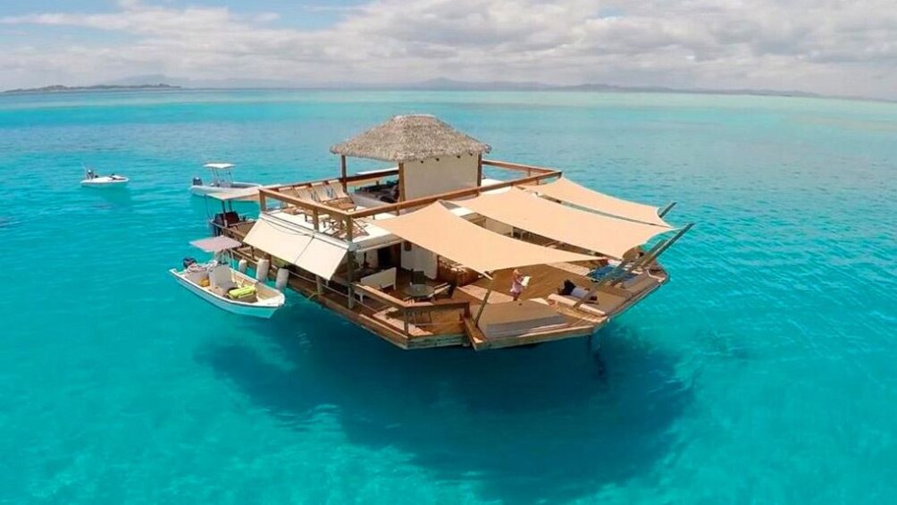 Cloud 9 floating cabana docked in a clear blue sea