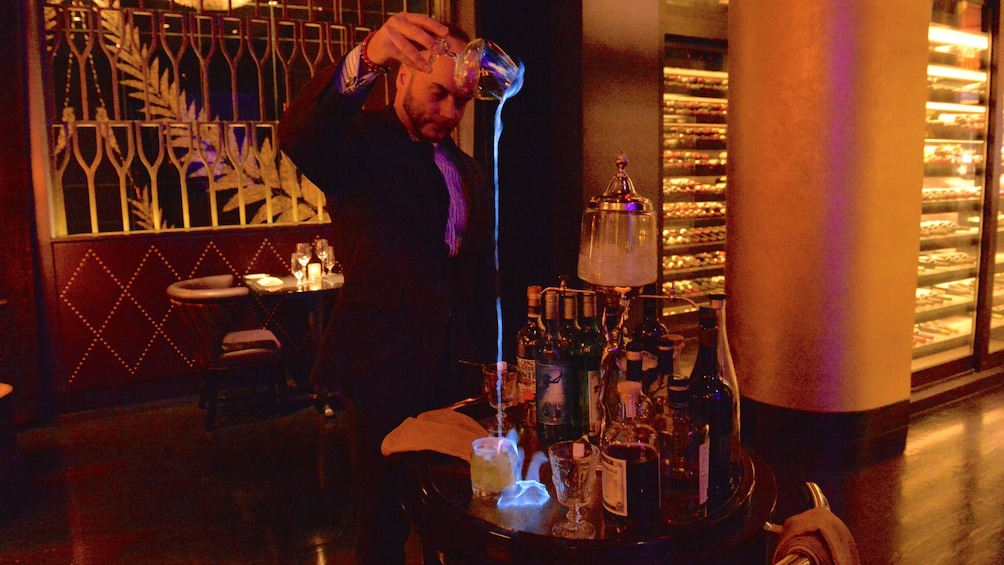 man pouring drinks