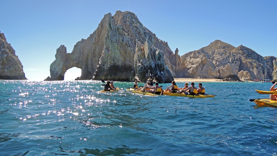 Group kayaking near the rock formations in Los Cabos