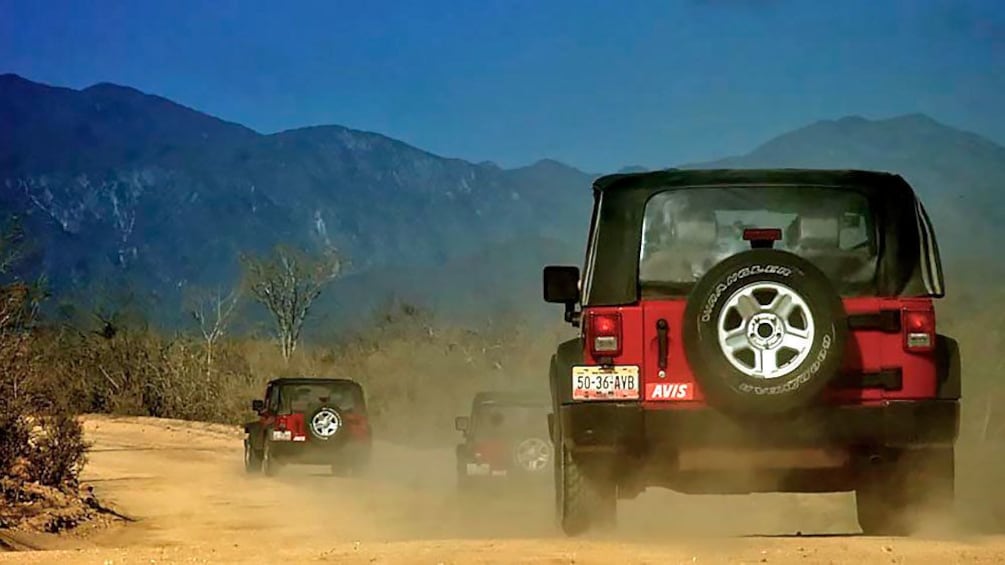 Show item 4 of 10. Jeep driving on the desert in Los Cabos