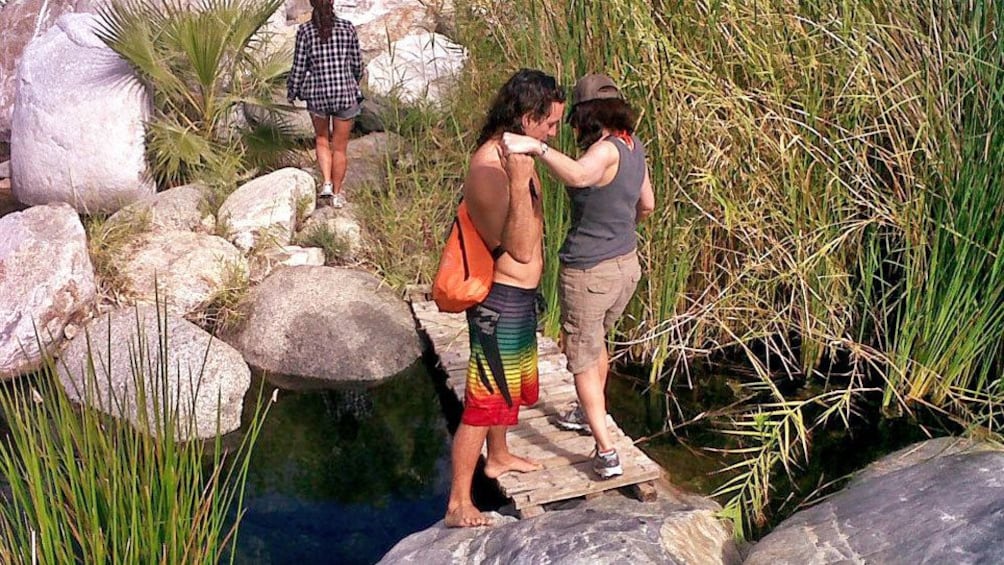 Show item 5 of 10. Crossing a small wooden bridge in Los Cabos