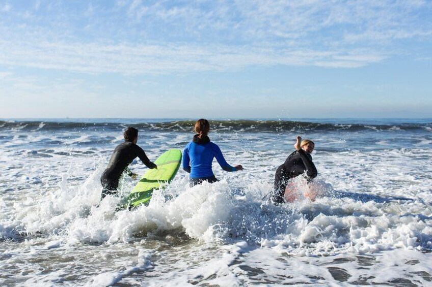 Paddling out to begin the surf lesson