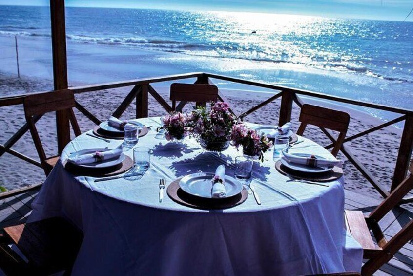 Show item 5 of 14. Dinner in front of the sea