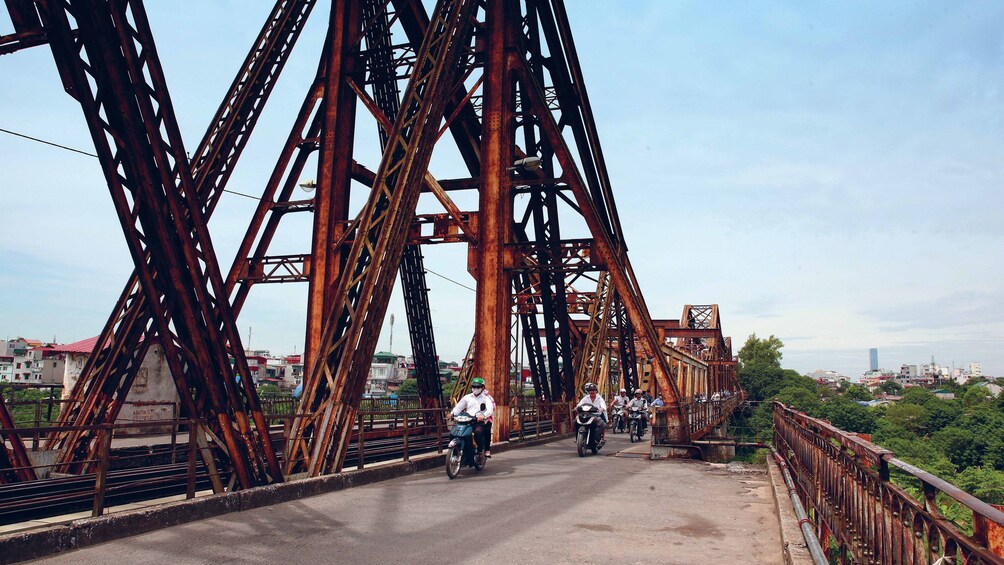 Bicycling group on the Long Biên Bridge in Hanoi