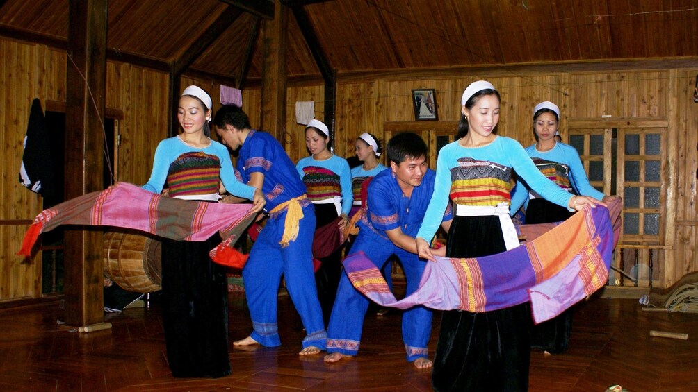 Women dancing with scarves in Mai Chau Valley