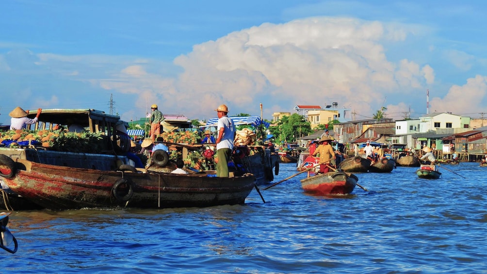 Boats with produce at the Cai Răng floating market in the Mekong Delta