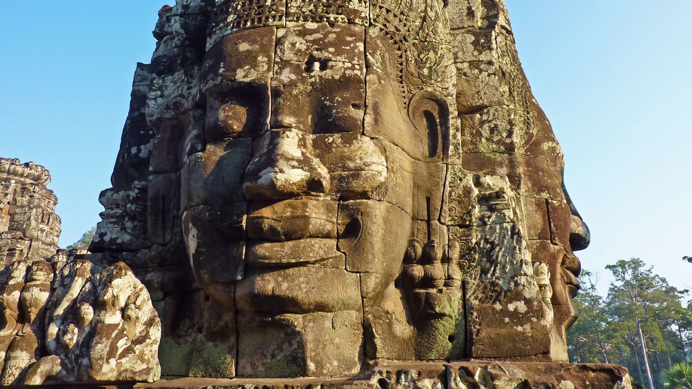 Face carved on the side of a temple at Angkor Wat in Siem Reap