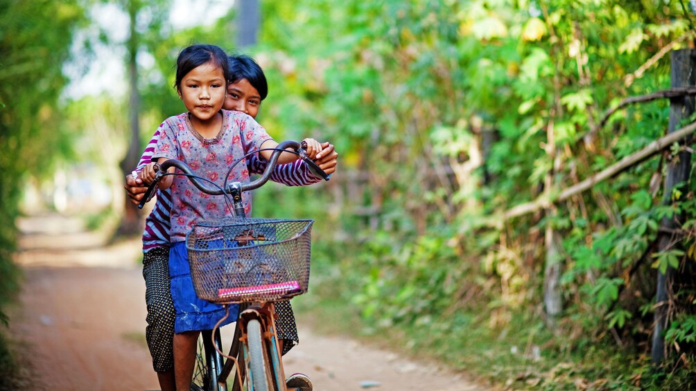 Pair of children on a bicycle in Siem Reap