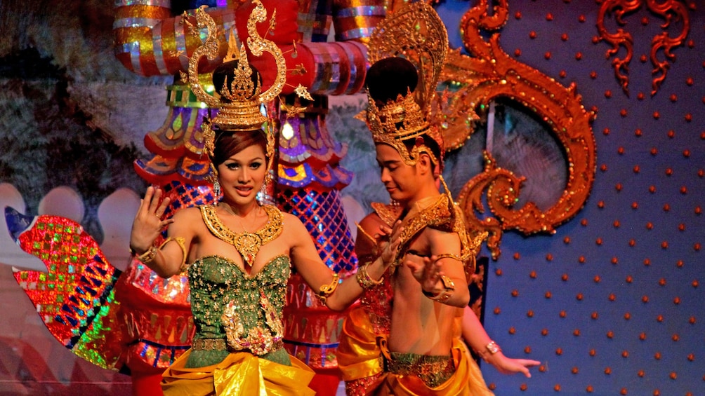 Apri foto 3 di 9. men and woman in costume performing on stage in Cambodia