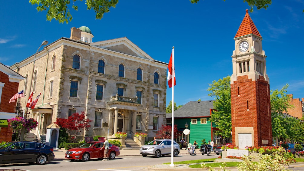 red brick tower near an old stone building in Canada