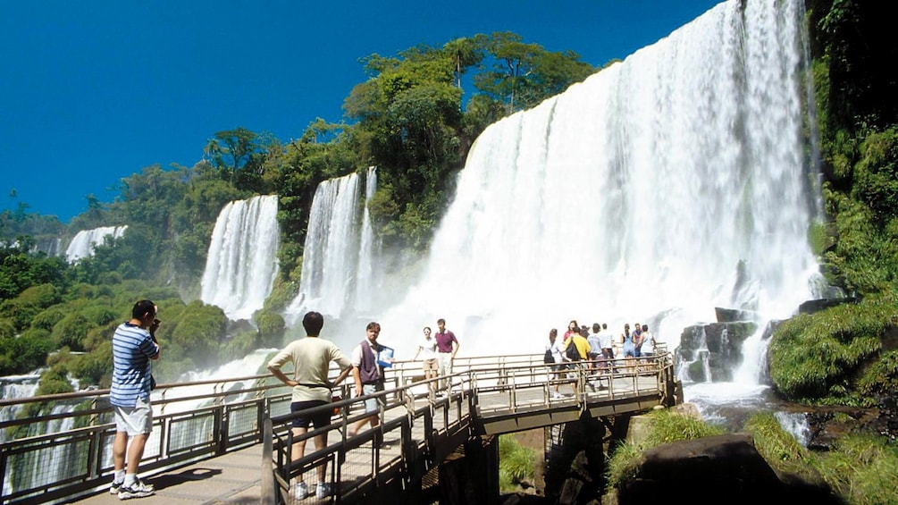 walking along the waterfalls on a walkway in Argentina