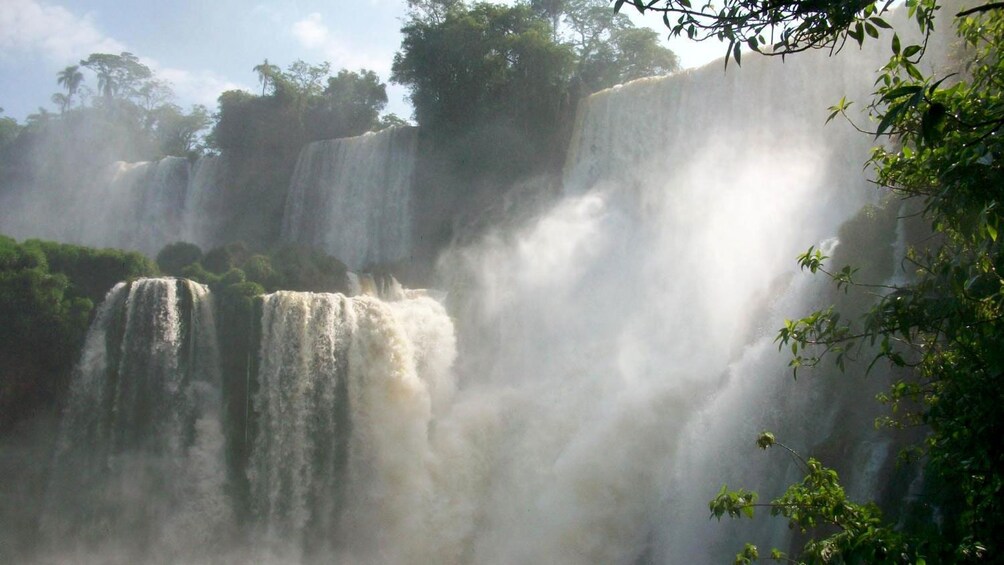 sunlit mist at the waterfalls in Argentina