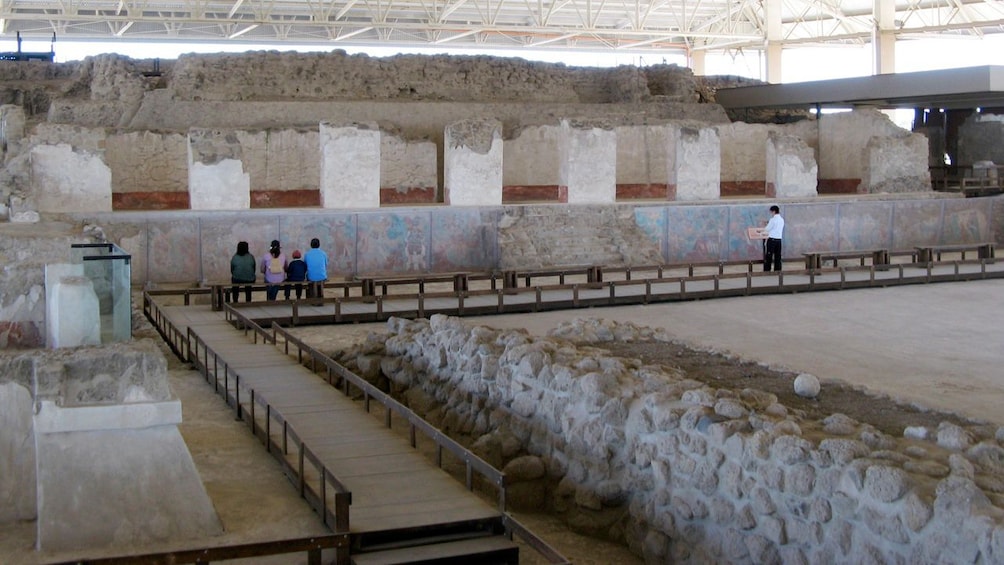 Tourists at the ruins of a temple in Cacaxtla