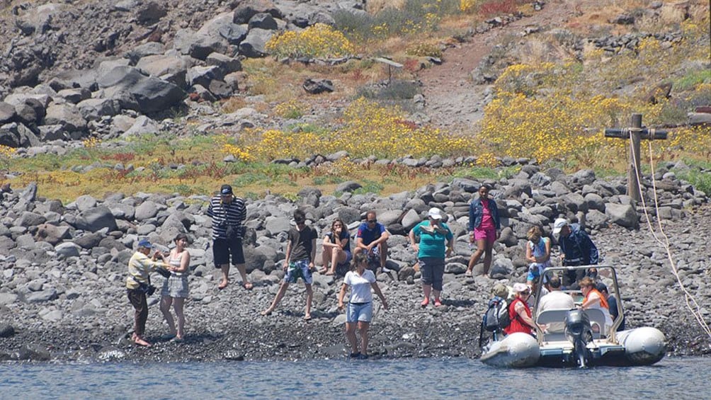 Tour group on the rocky shore of Desertas Islands