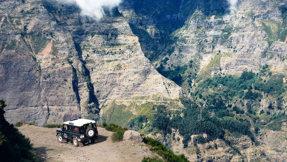 Jeep near the edge of a cliff on Madeira Island
