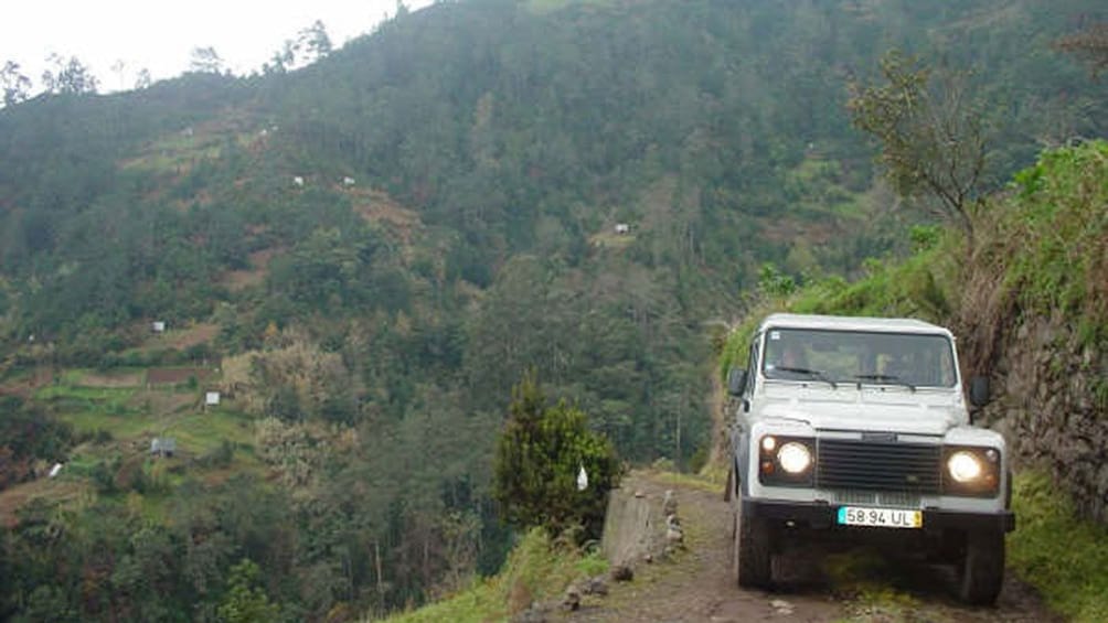 Jeep on a cliffside road on Madeira Island