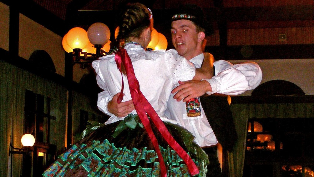 Two folk dancers performing in budapest