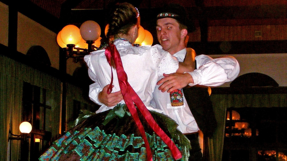 Two folk dancers performing in budapest