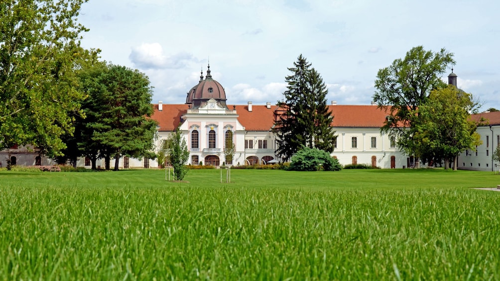 view of a building from a grassy lawn in budapest