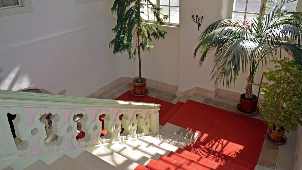 red carpeted interior of a building in Budapest
