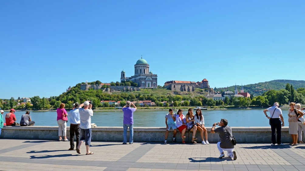 People taking photos on the banks of the Danube river near Budapest