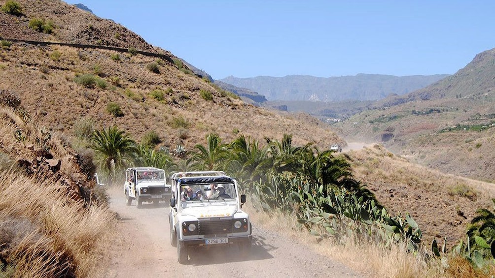 Jeeps on a dirt road in the hills of Gran Canaria