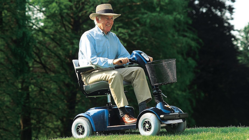 elderly man riding his scooter through the park in Las Vegas