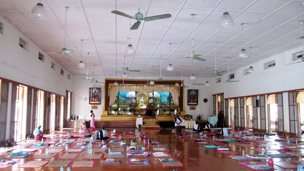 Mats lined up on the floor inside the Mahasi Meditation Center in Myanmar