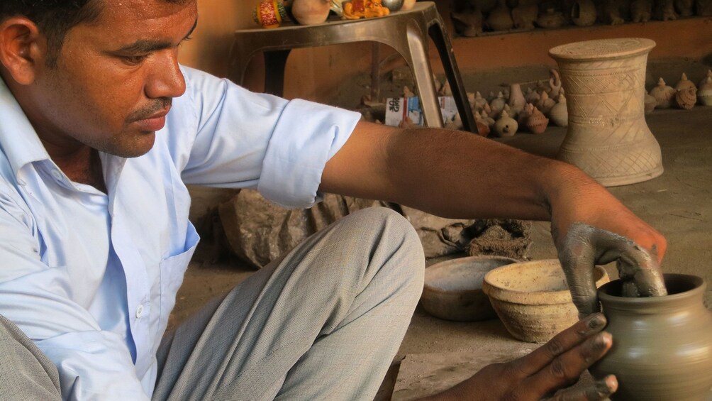 Craftsman making potter by hand in Myanmar
