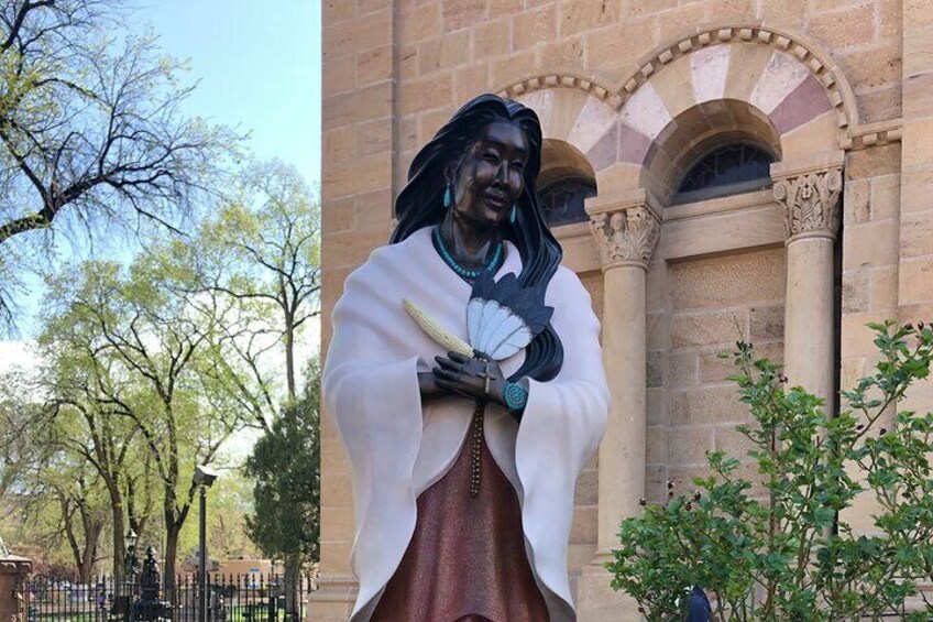 The statue of St. Kateri Tekawitha in front of the Cathedral Basilica of St. Francis of Assisi.