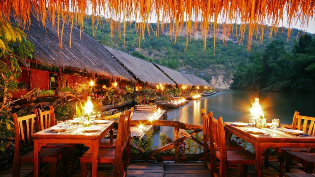 Dining room at a floating hotel on the River Kwai in Thailand