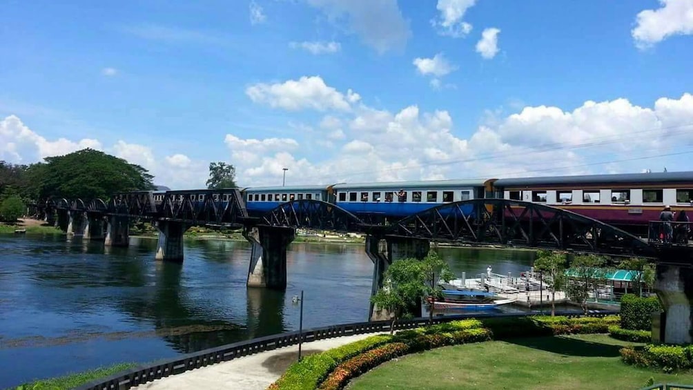 Train on a railway over the River Kwai in Thailand