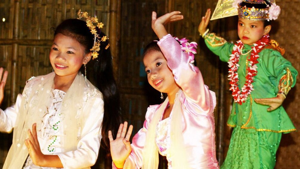 Young girls performing traditional Mon dance in the Kanchanaburi Province