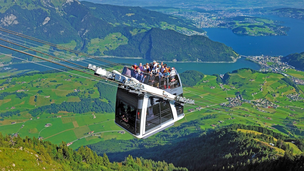 Double-decker gondola going up to Mount Stanserhorn in Switzerland