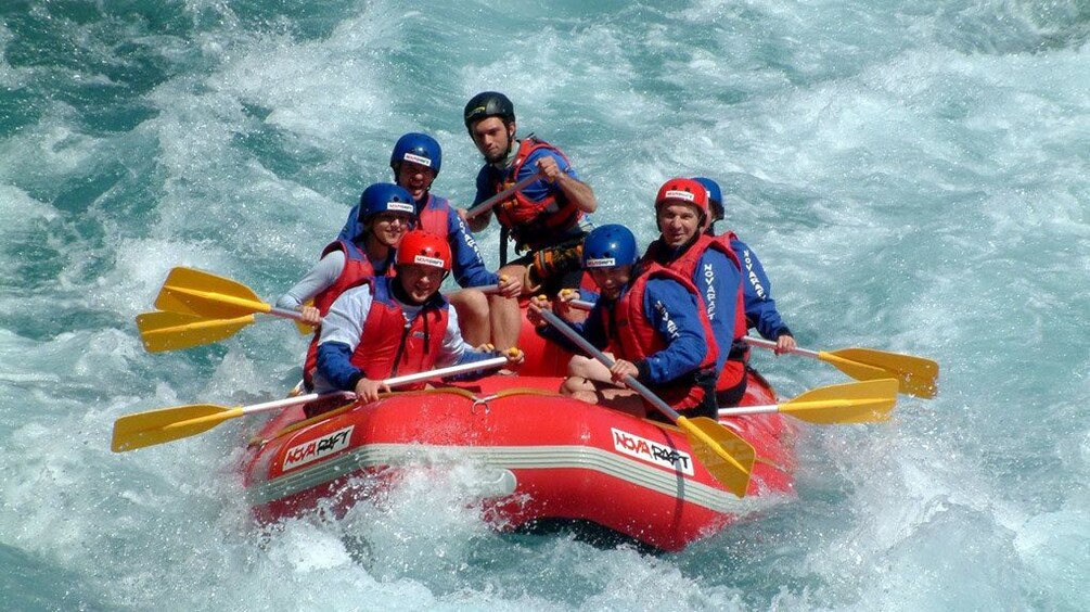 People on a raft navigating some rapids in Antalya