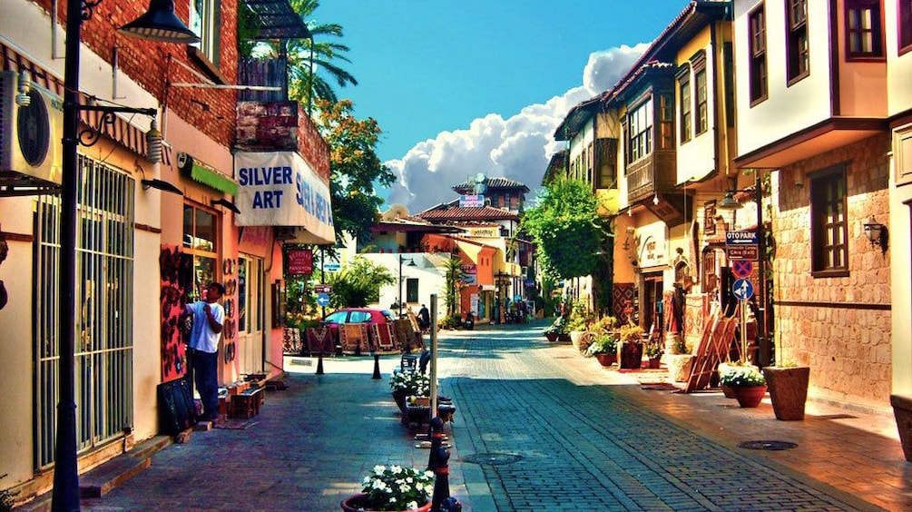 Storefronts lining cobblestone streets in Antalya