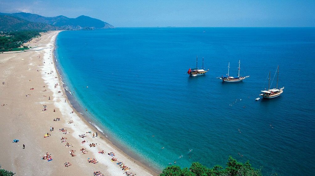 Boats docked off the shore of Olympos