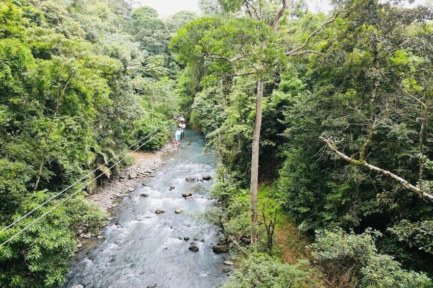 3 in 1, zipline over blue river, tubing on blue river and sloths