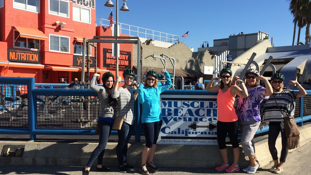 friends posing at muscle beach
