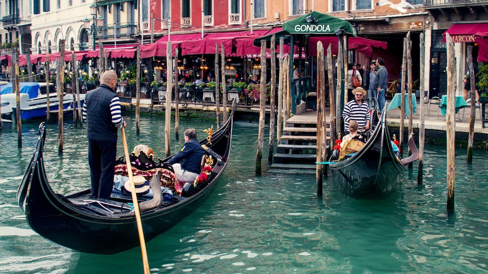 visitors riding the gondolas in Venice